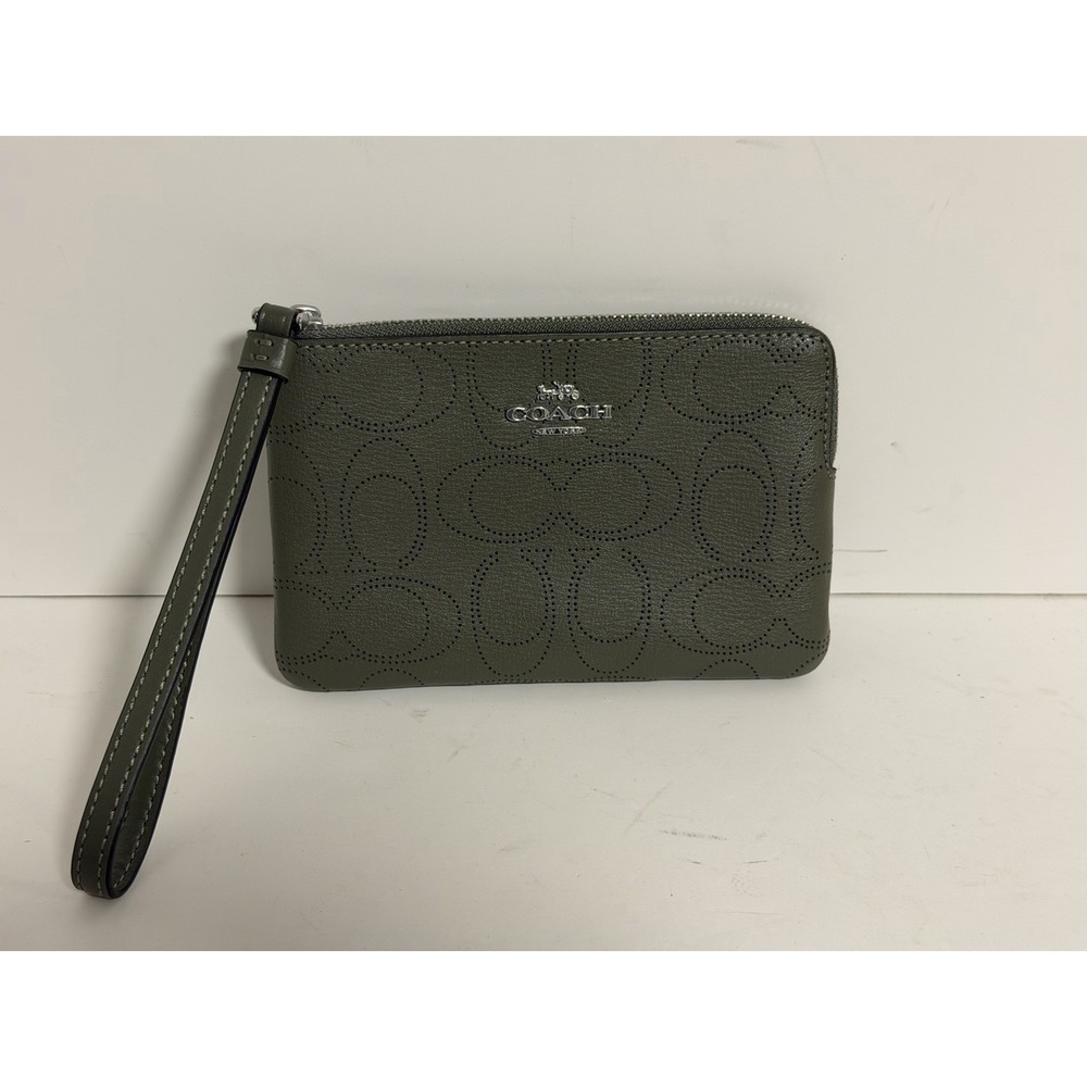 Coach Perforated Signature Corner Zip Wristlet in the color Surplus